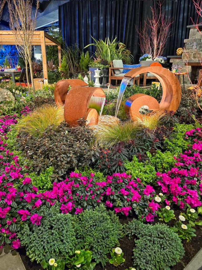 flowers and water feature displayed at the Northwest flower and garden festival