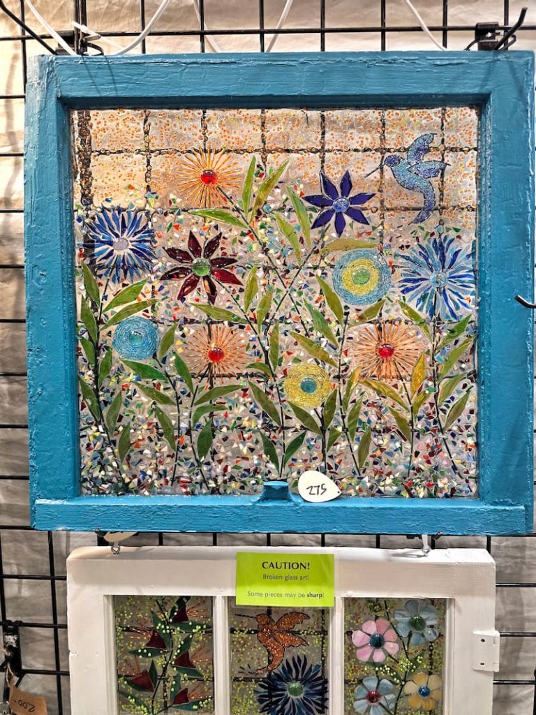 window art hanging in a booth at the Northwest flower and garden festival