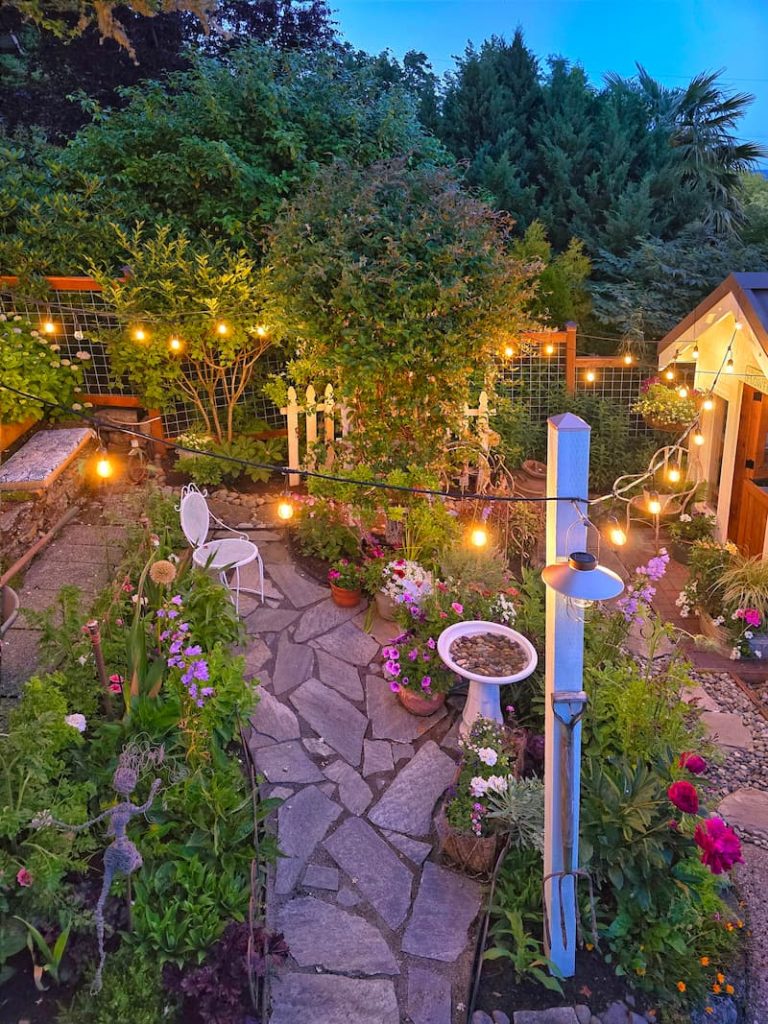 evening view of greenhouse patio and garden