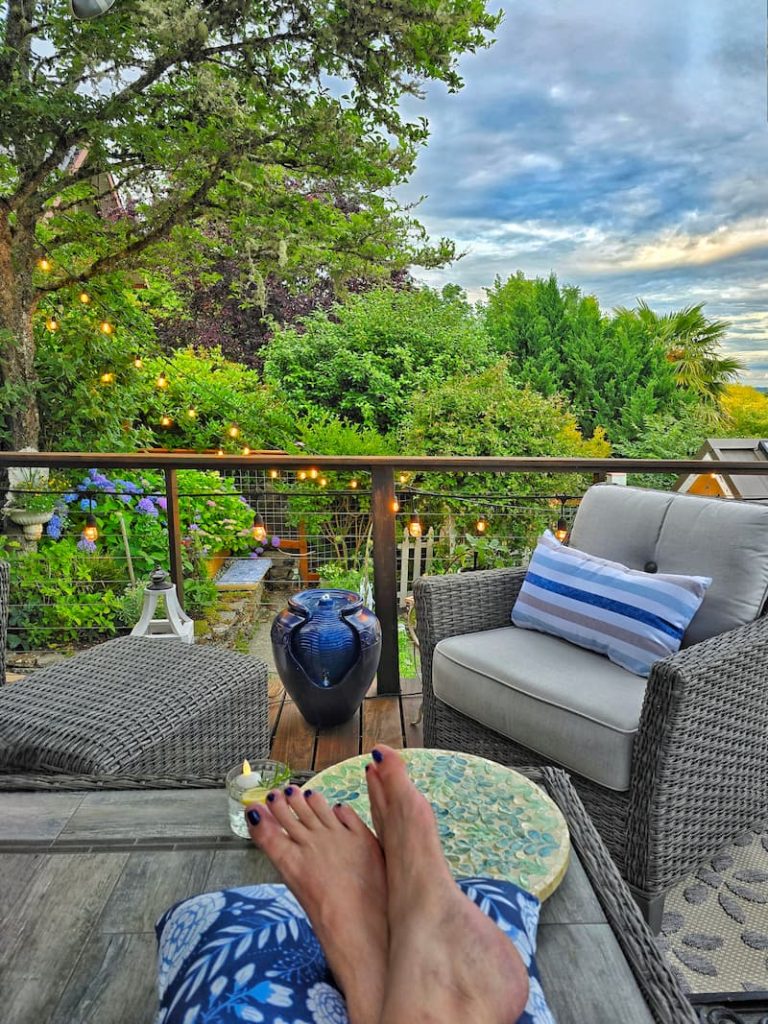 on the deck in the summer with feet up