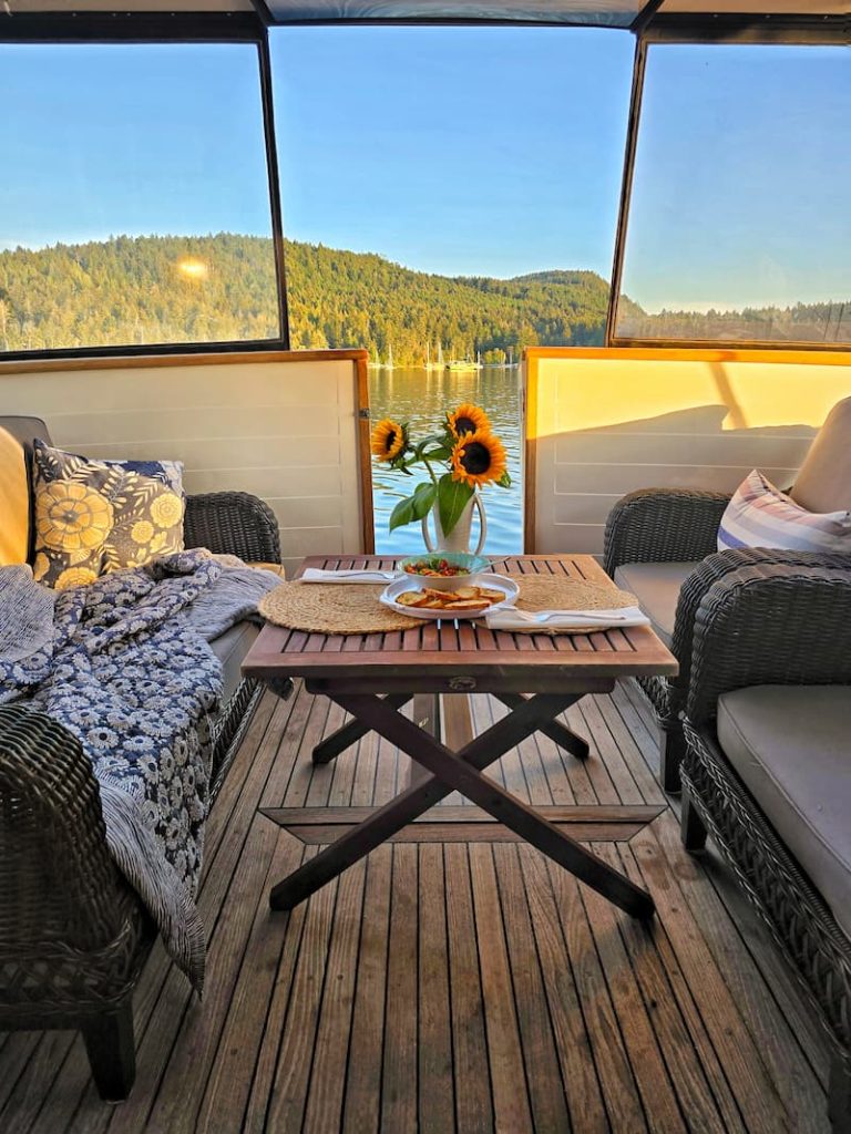 boat cockpit seating with sunflowers on the table