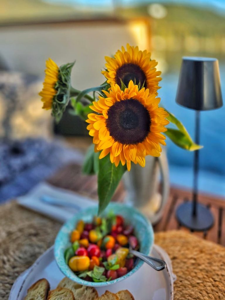 sunflowers and tomatoes at the table