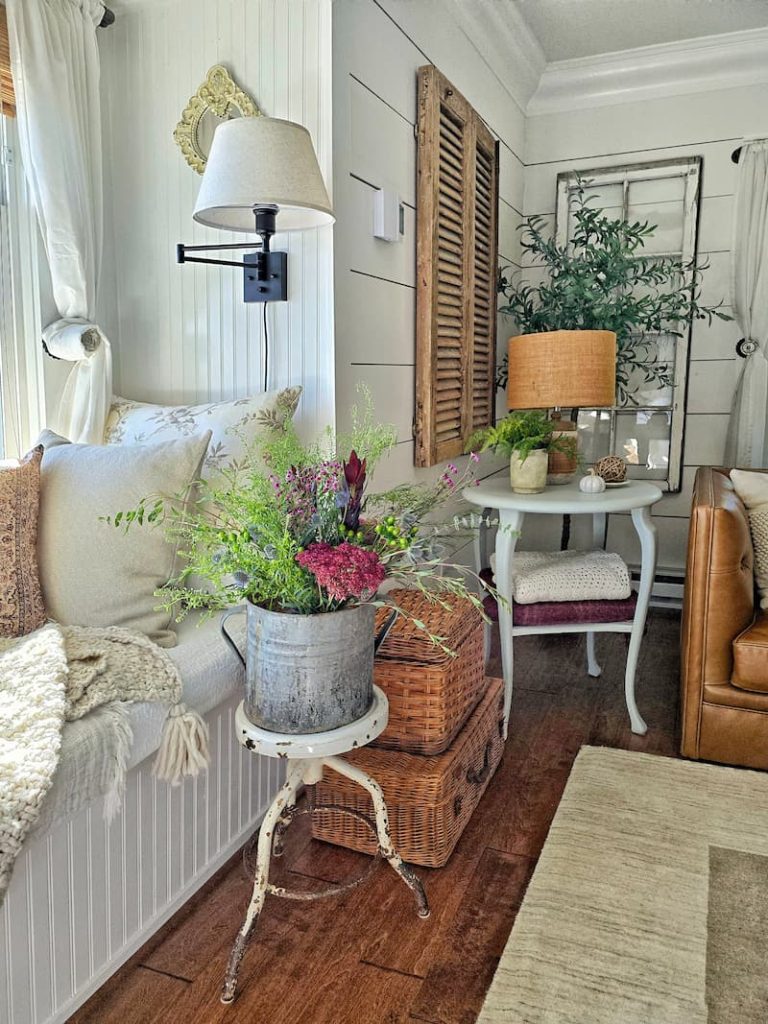 Wicker basket with dried flowers in a cottage living room