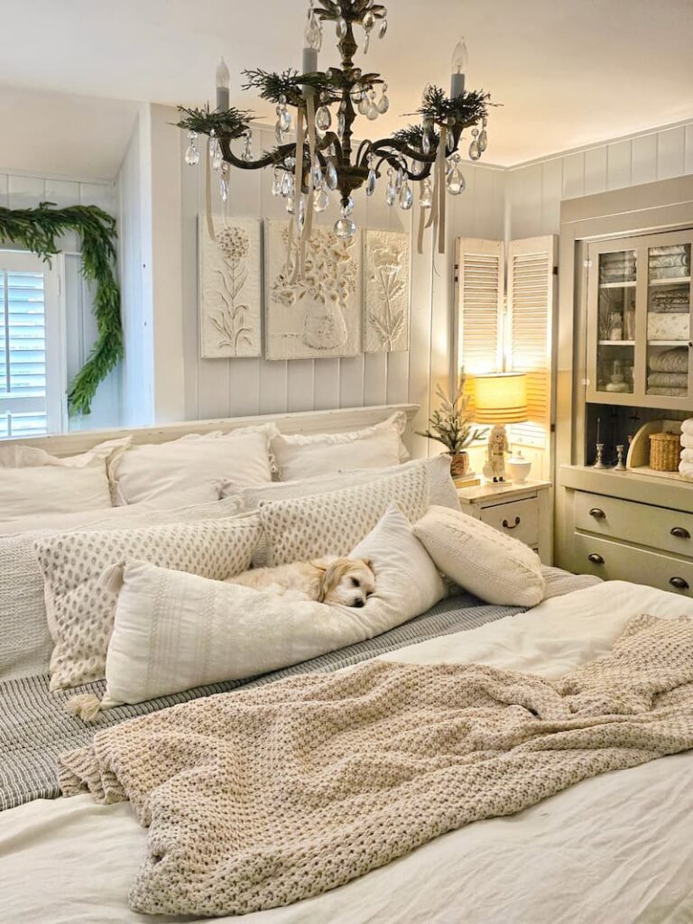 dog sleeping in the cottage bedroom decorated for Christmas