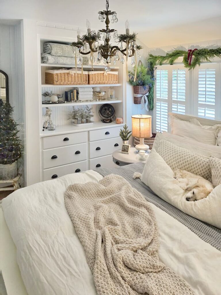 dog sleeping in the cottage bedroom decorated for Christmas