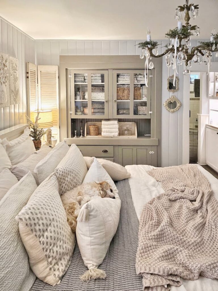 dog sleeping in the cottage bedroom decorated for Christmas