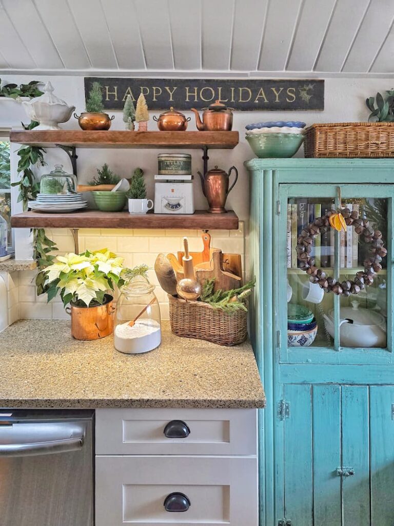 Embrace Christmas Charm with These Classic Decor Ideas: open shelving with vintage finds and aqua cabinet