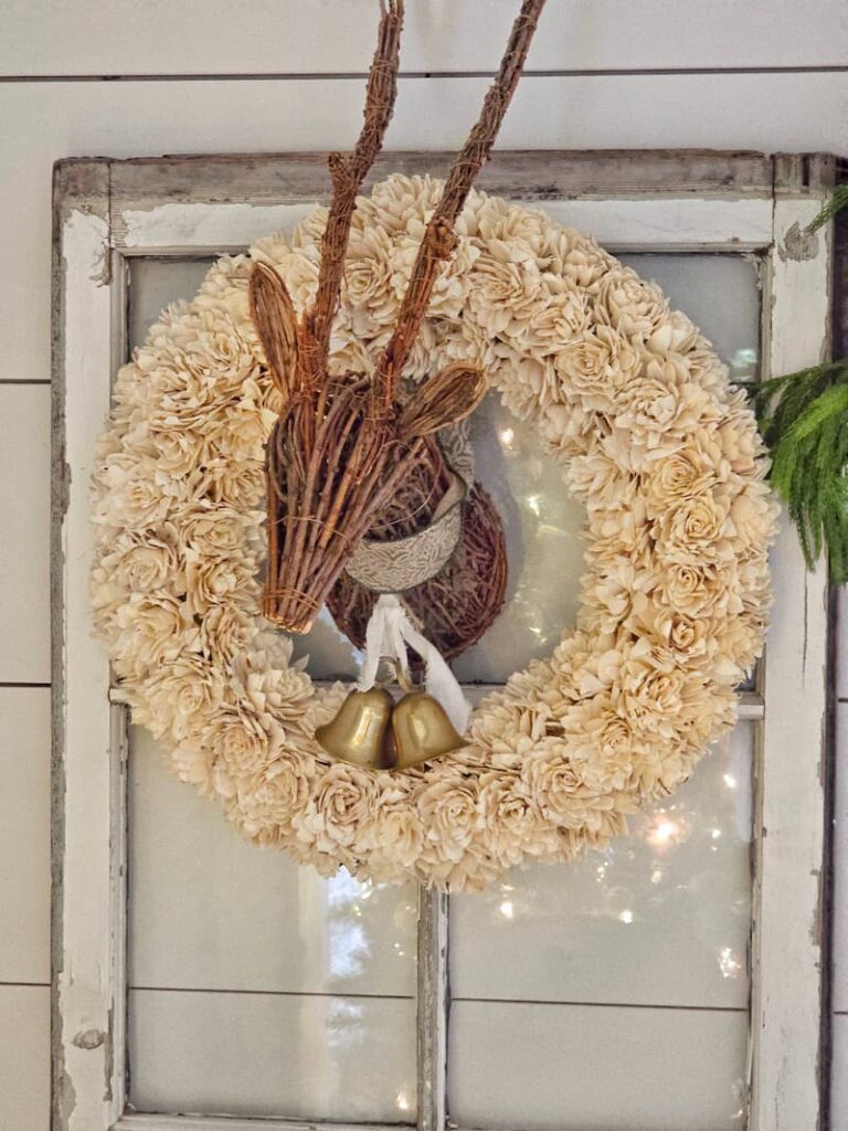 white wooden flower wreath with reindeer head