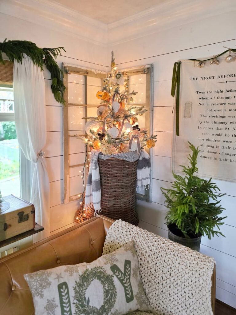 Embrace Christmas Charm with These Classic Decor Ideas: hanging basket with Christmas tree and other decorations