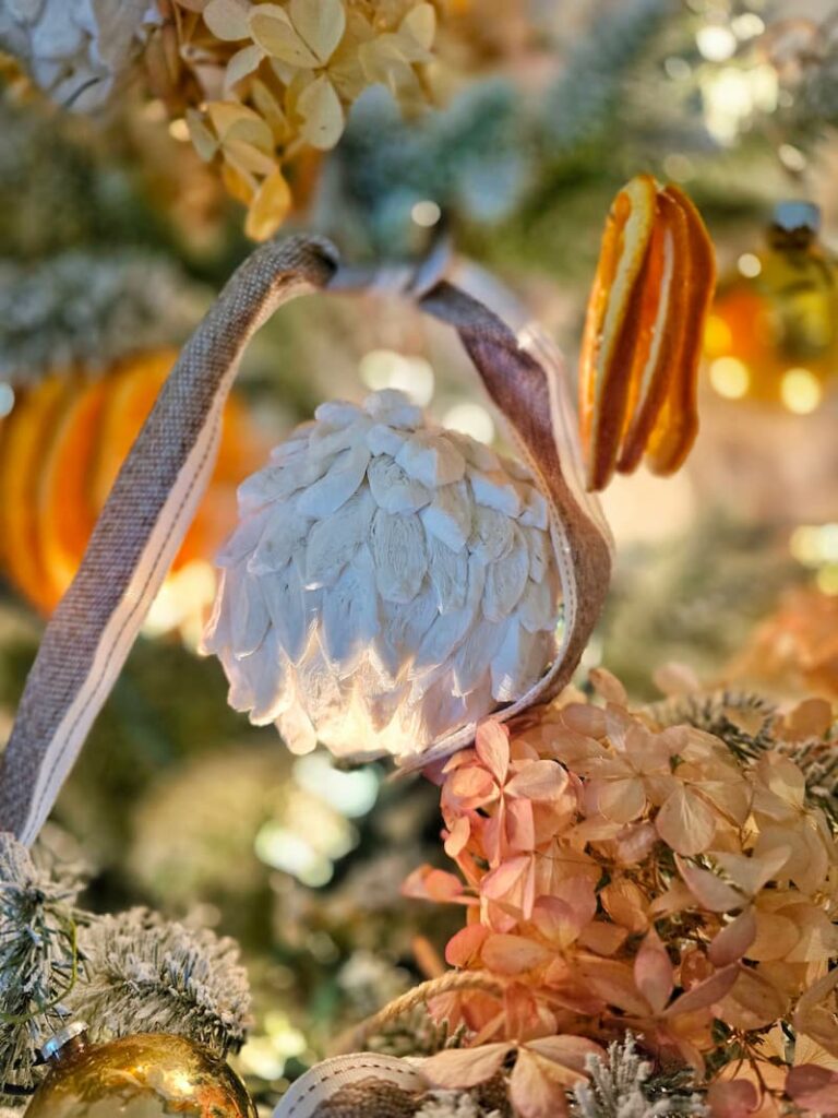 white textured ornament on the Christmas tree