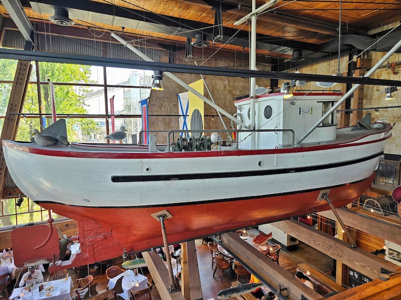 the boat that hangs above the dining tables in the Sandbar Restaurant