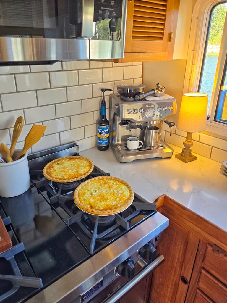 2 quiches sitting on stove on the boat