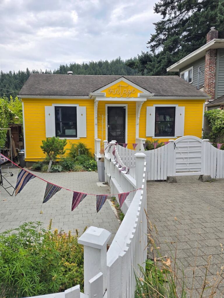 bright yellow shop in the town of Snug Harbour