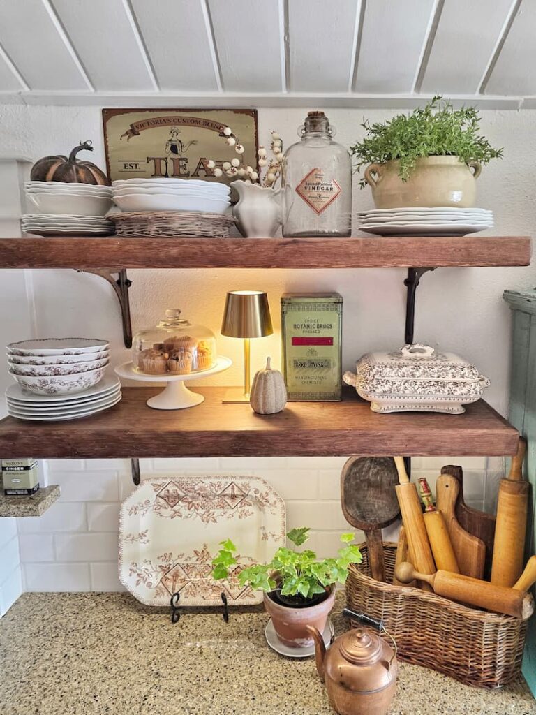 vintage items on open shelving in cottage kitchen