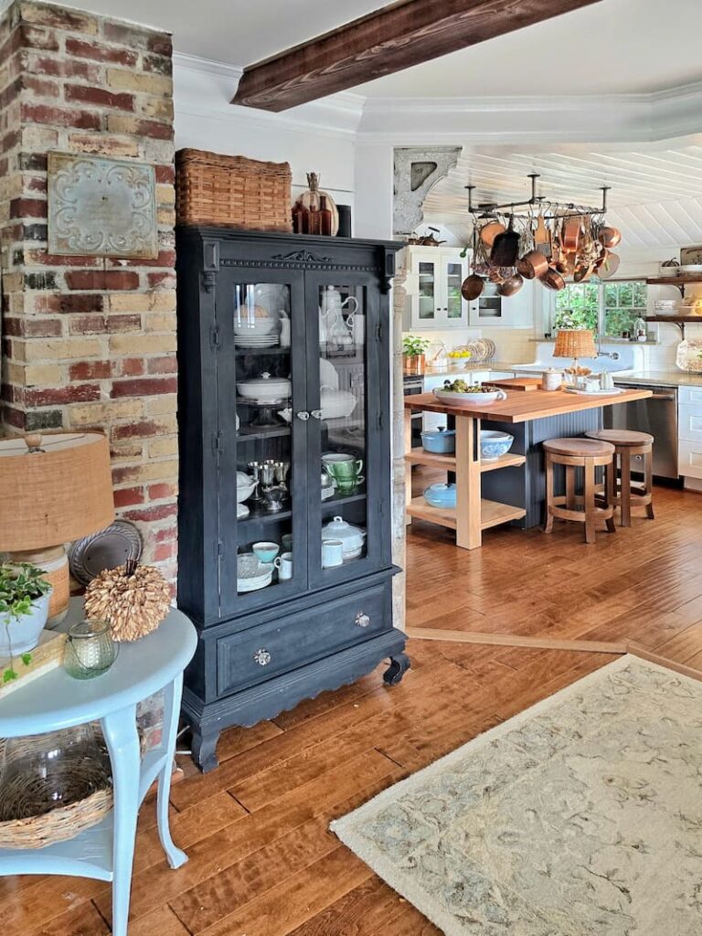 cottage kitchen and living room decorated for fall