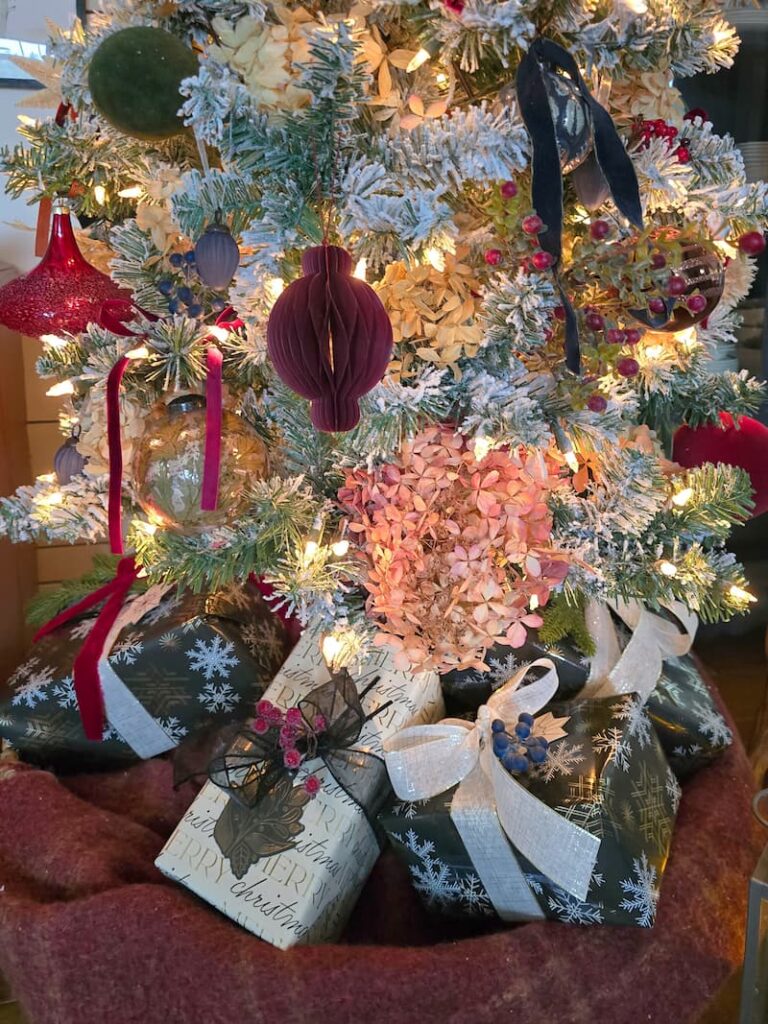 black and cream wrapped gifts under the tree