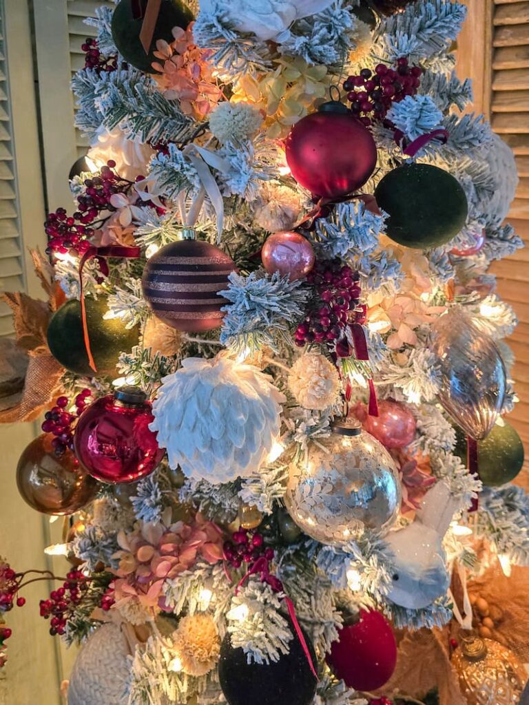 brown, green, burgundy, white, and pink ornaments on a Christmas tree