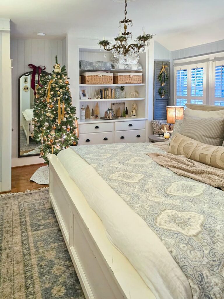 cottage bedroom decorated for Christmas with pale blue and neutral colors