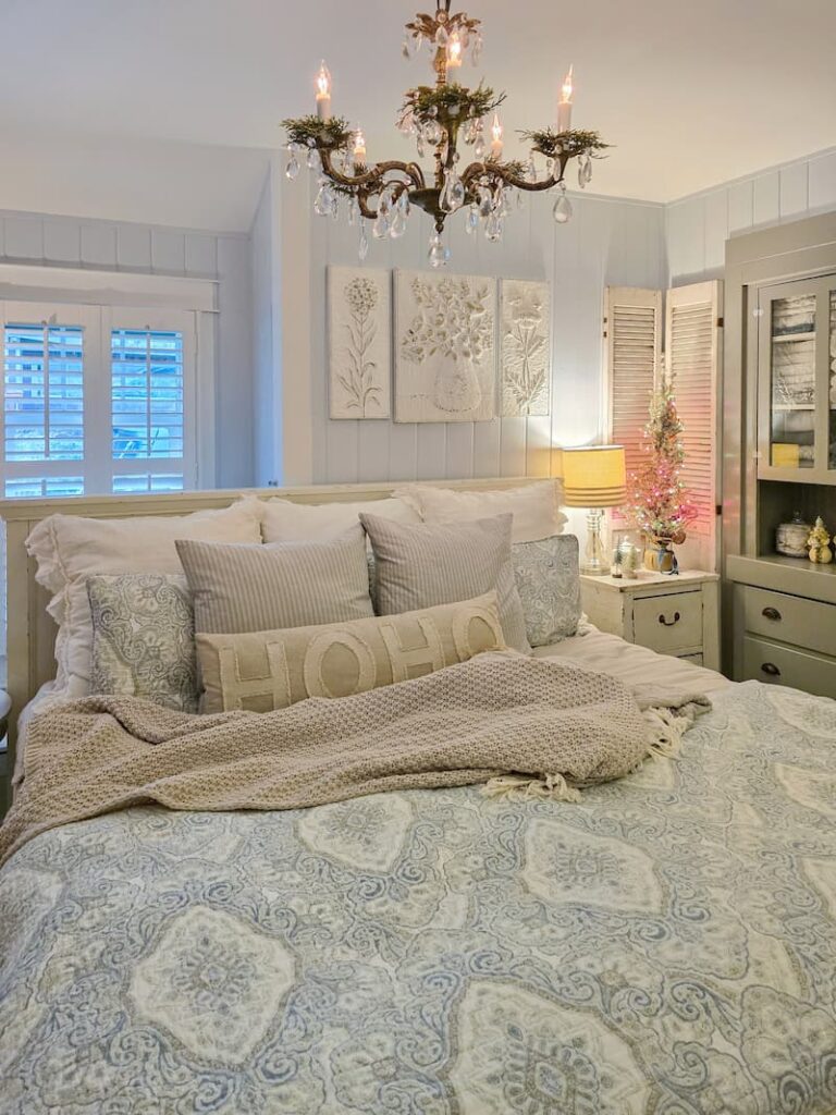 cottage bedroom decorated for Christmas with pale blue and neutral colors