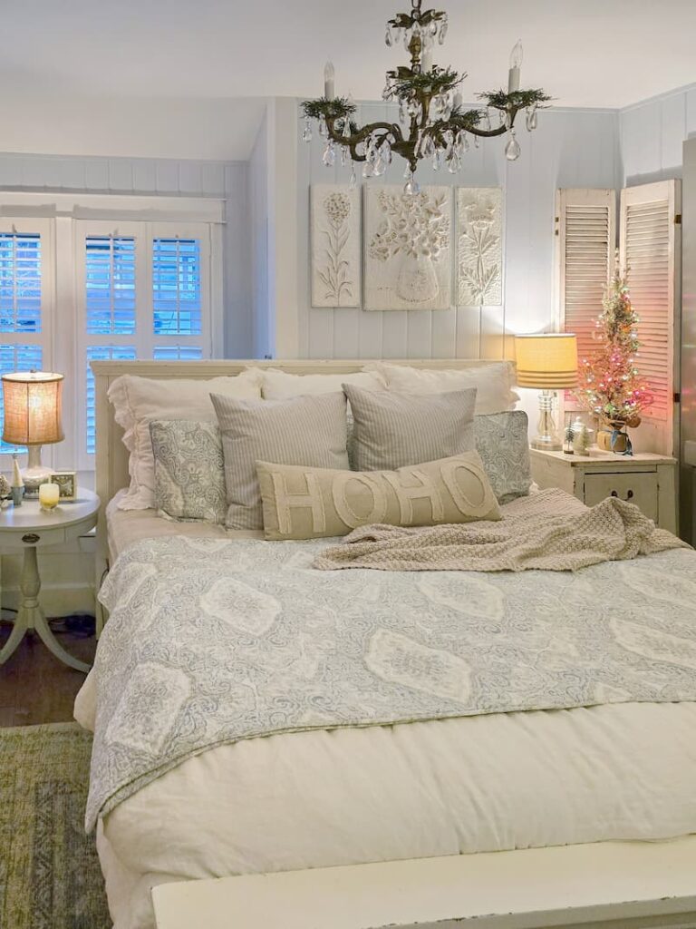cottage bedroom decorated for Christmas with pale blue and neutral colors