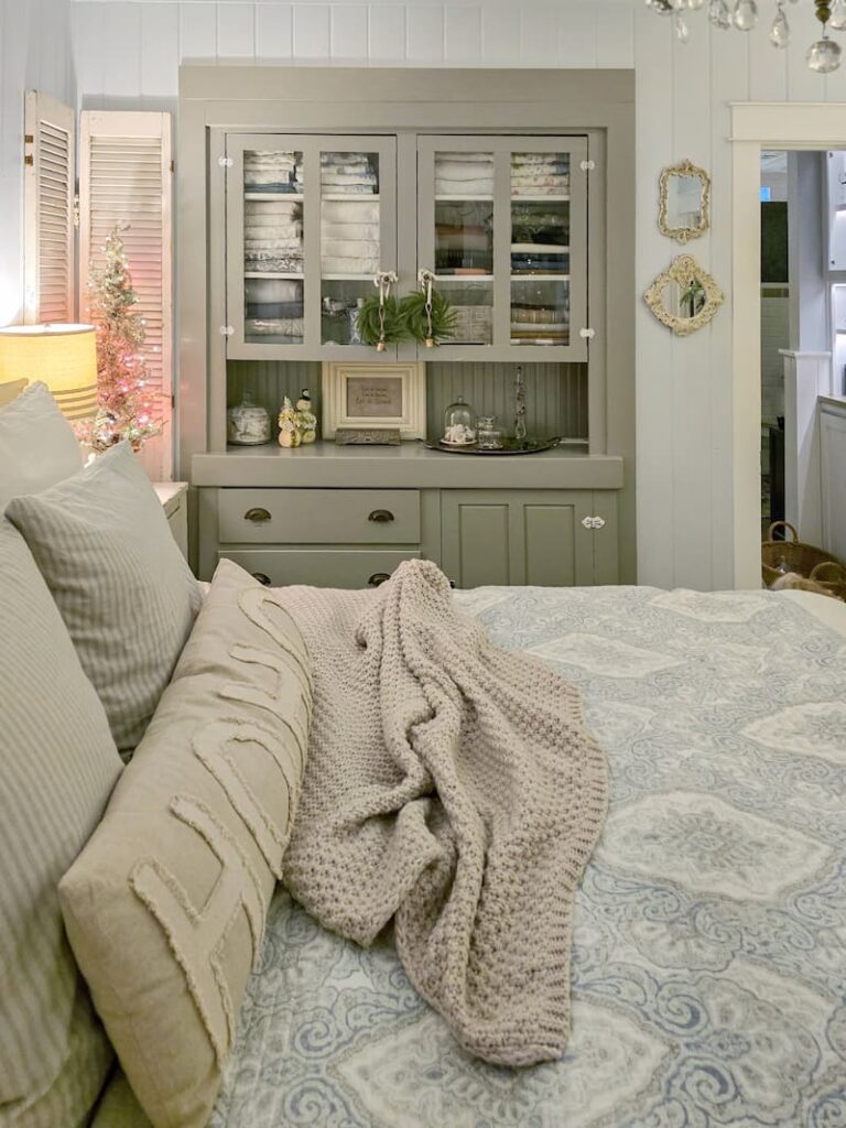 antique built-in cabinet in bedroom decorated for Christmas