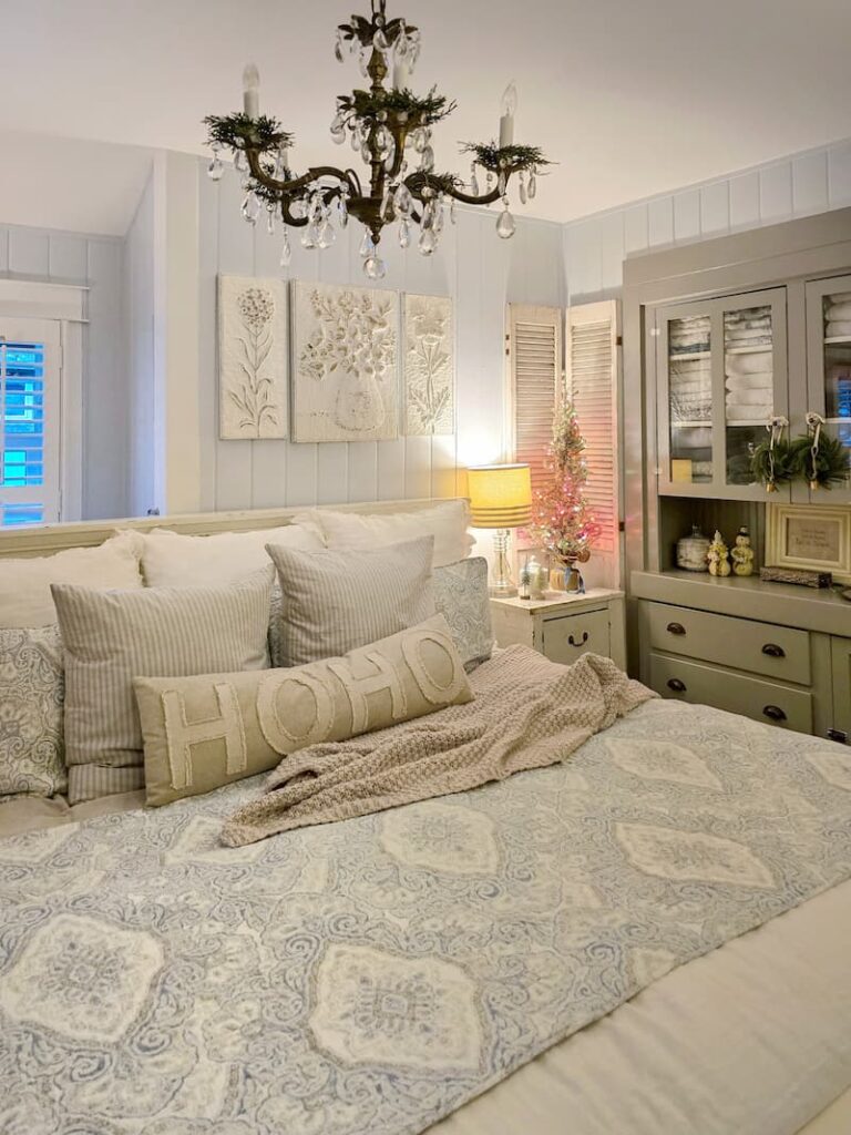 cottage bedroom decorated for Christmas with pale blue and neutral colors
