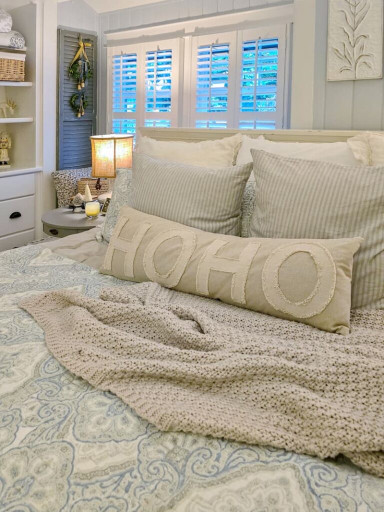 cottage bedroom decorated for Christmas with pale blue and neutral colors