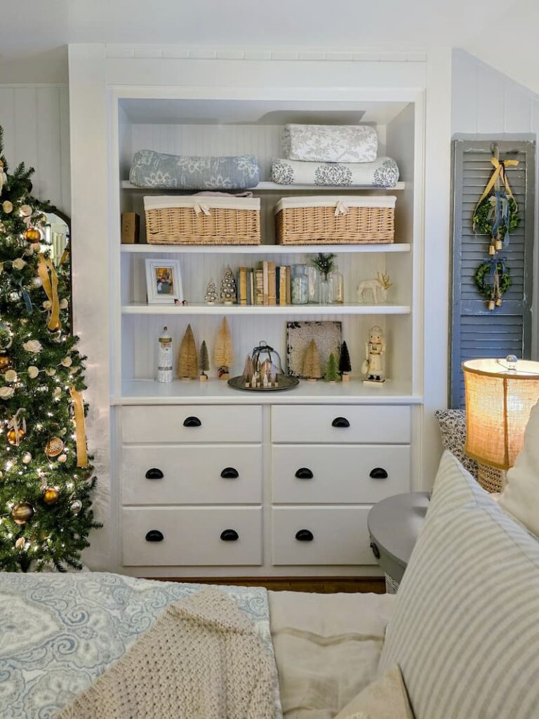 Bedroom built-in cabinet with neutral Christmas decor