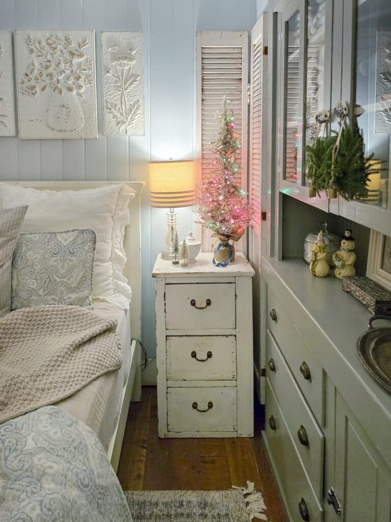 bedroom nightstand with vintage tinsel small tree with pink and turquoise lights