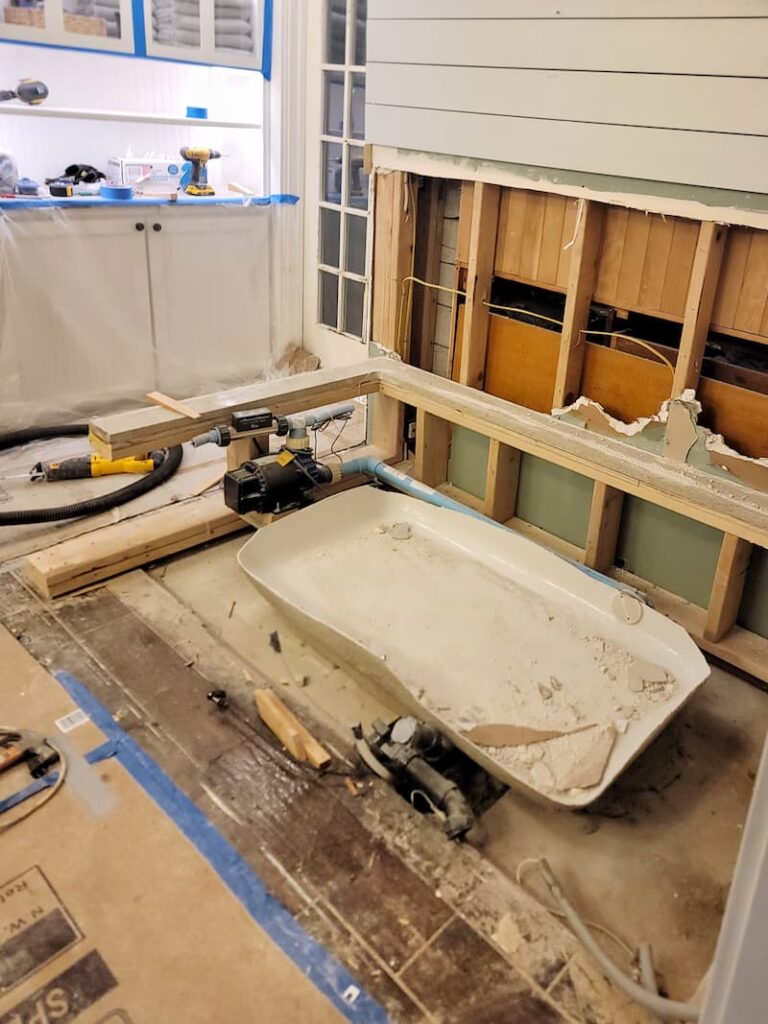 view of thebathroom after the tub was removed