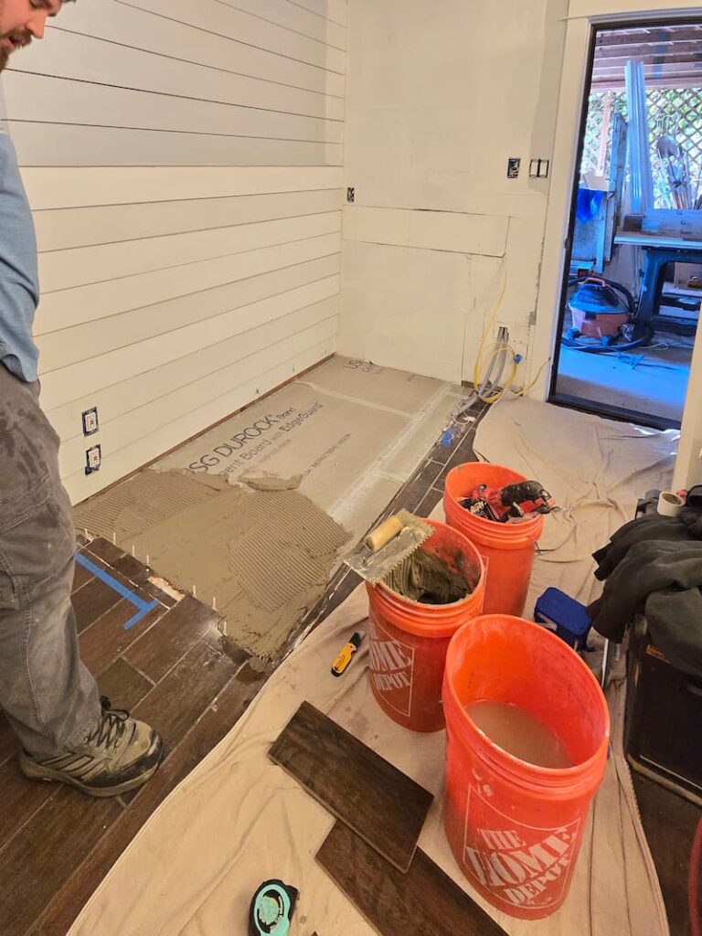 tile being laid in the bathroom