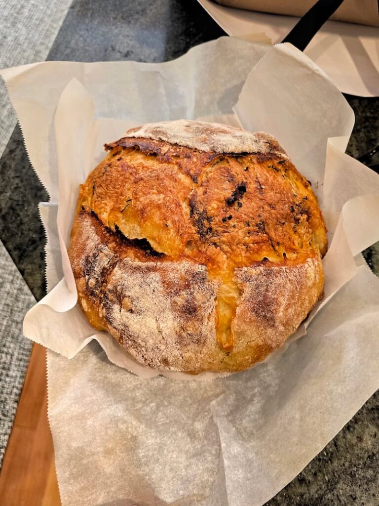 a loaf of homemade sour dough out of the oven