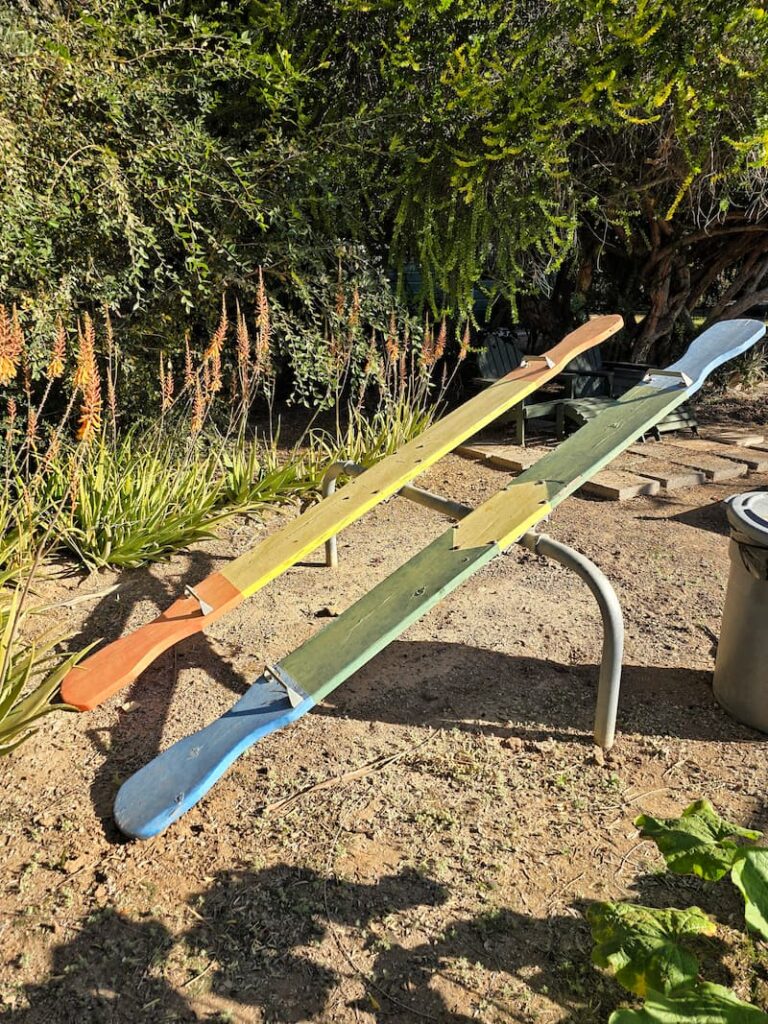 vintage see saw in the backyard