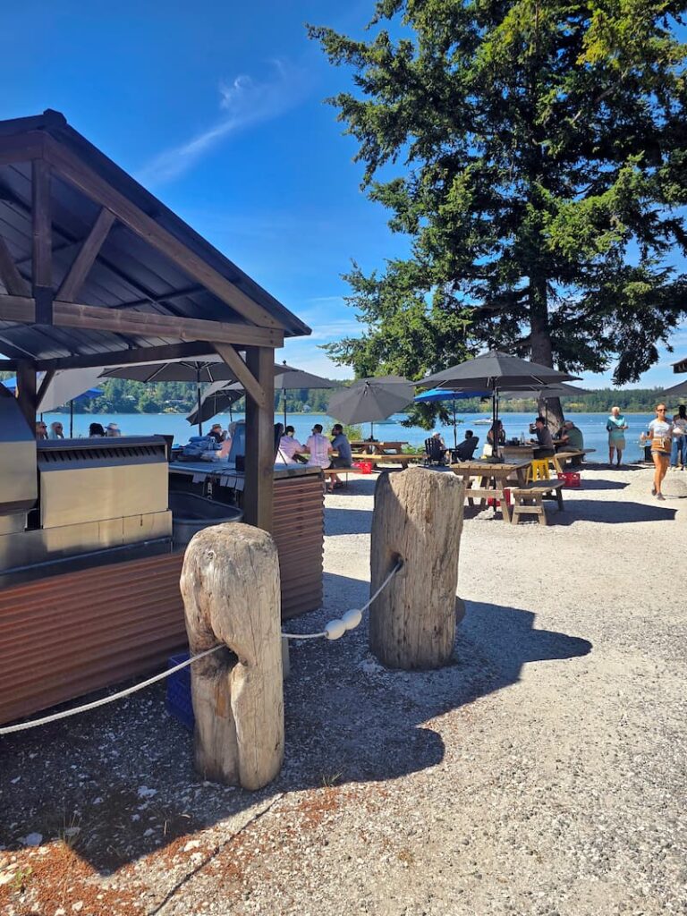 outdoor eating area with umbrellas at Westcott Bay Shellfish Co.