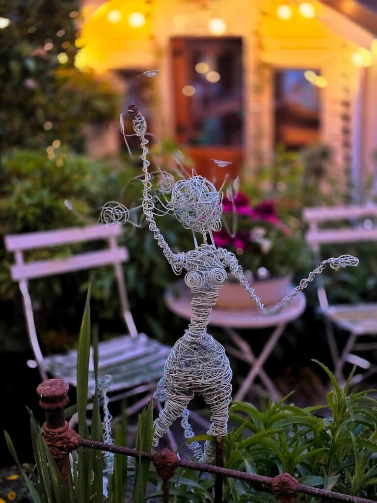 turquoise wire garden fairy in the garden