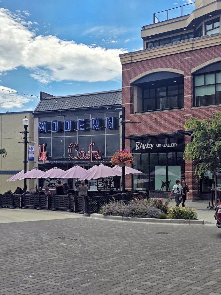 Modern Cafe with pink umbrellas in front