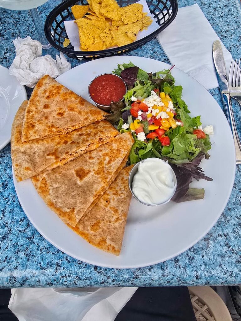 quesadillas and salad on a dish