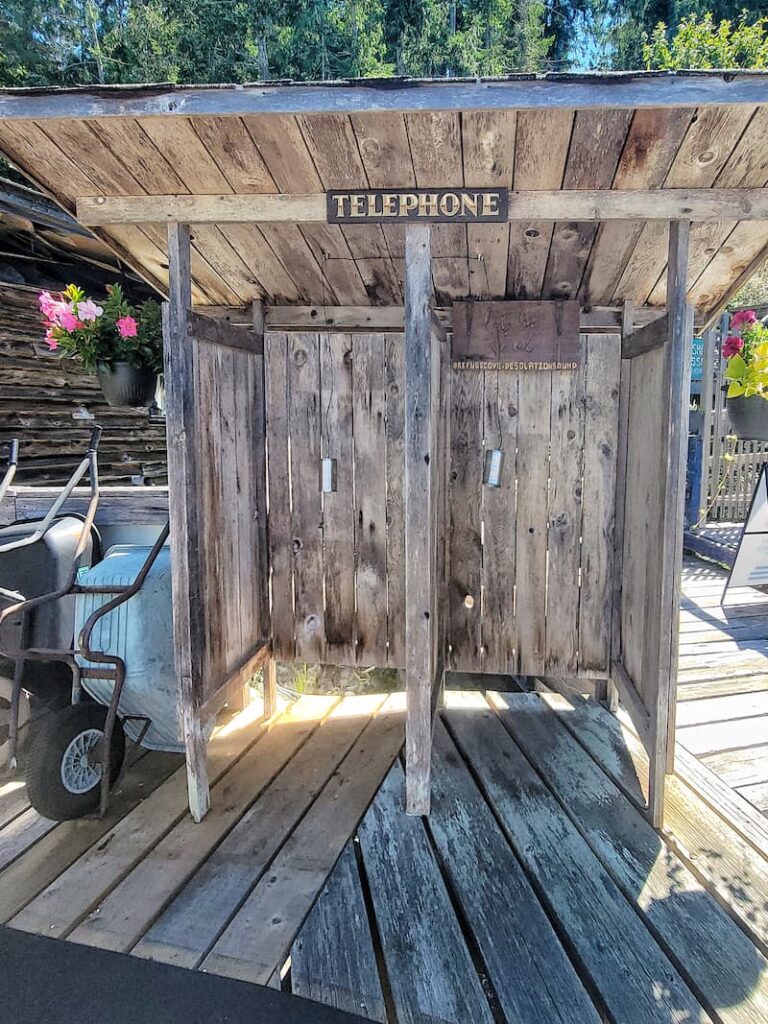 a wooden telephone booth in Refuge Cove in Desolation Sound BC Canada