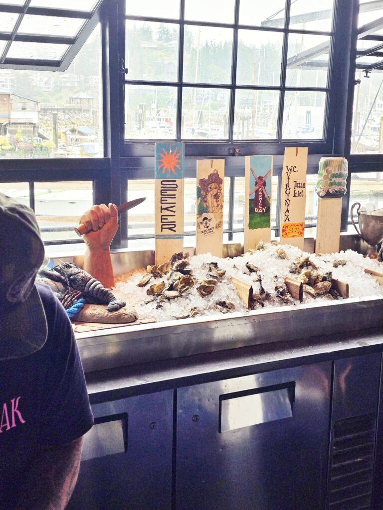 Shucking oysters at Smitty's Oyster Bar in Gibsons, BC Canada