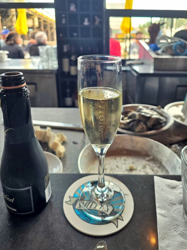 glass of bubbles at Smitty's Oyster Bar in Gibsons, BC Canada