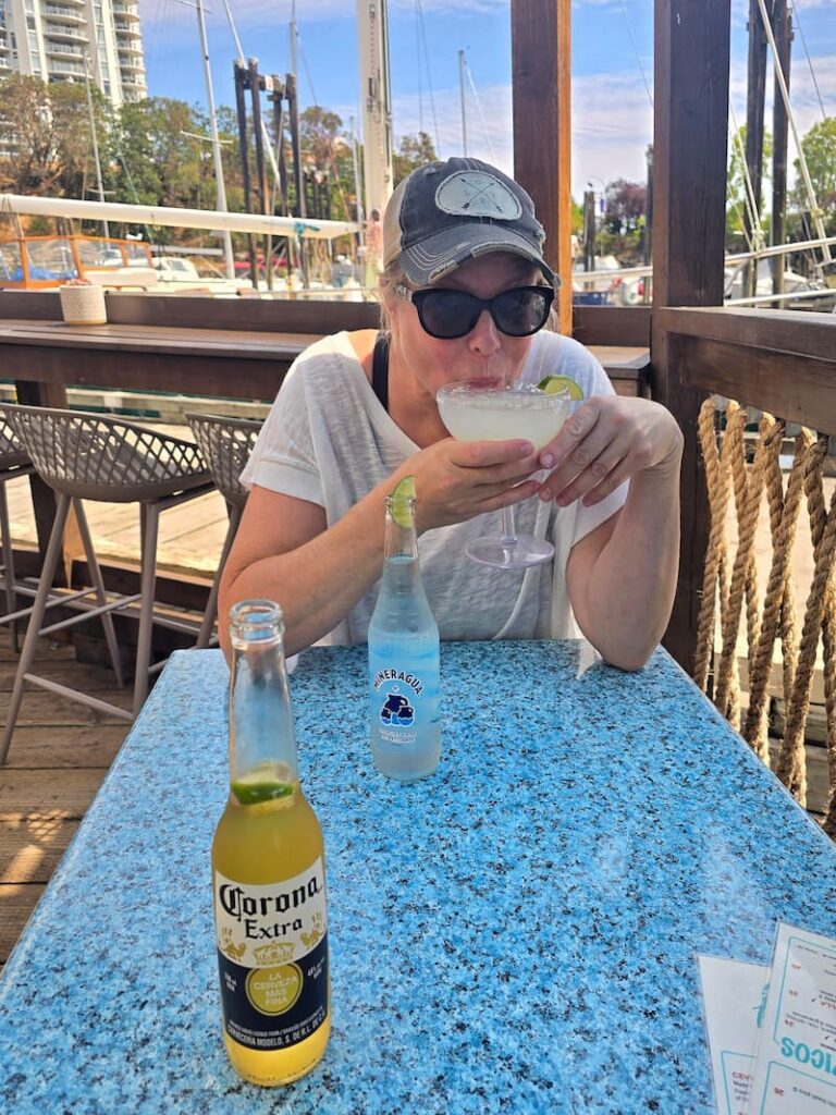woman sipping a margarita