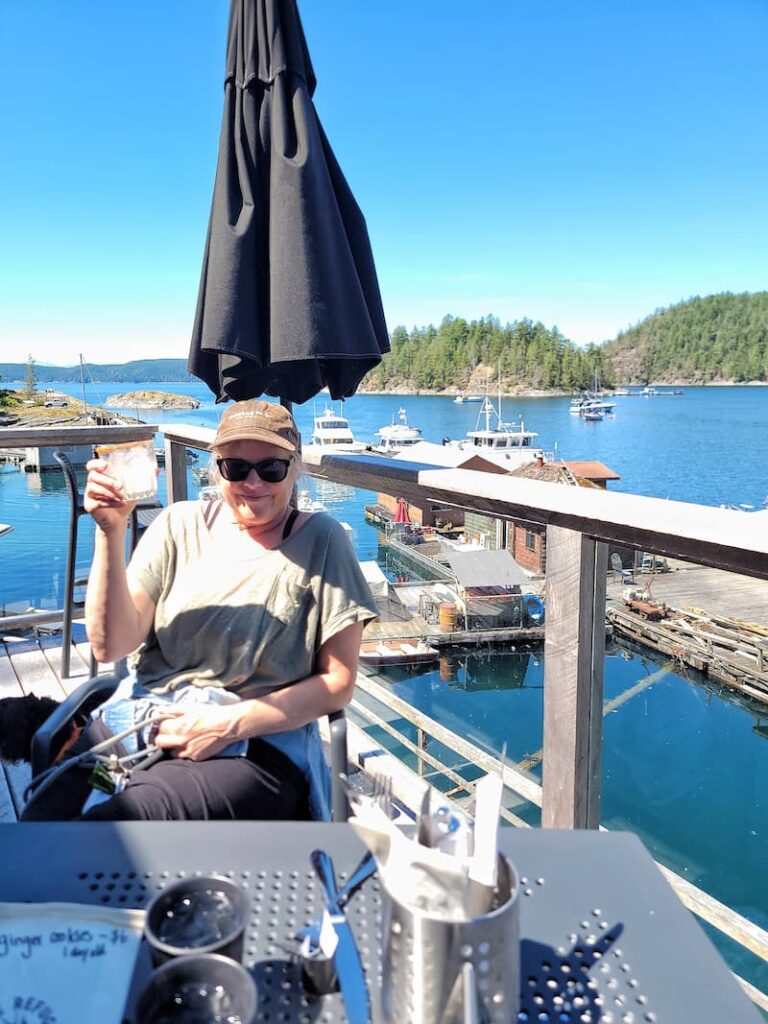 having a margarita at Refuge Cove outdoor cafe in Desolation Sound BC Canada