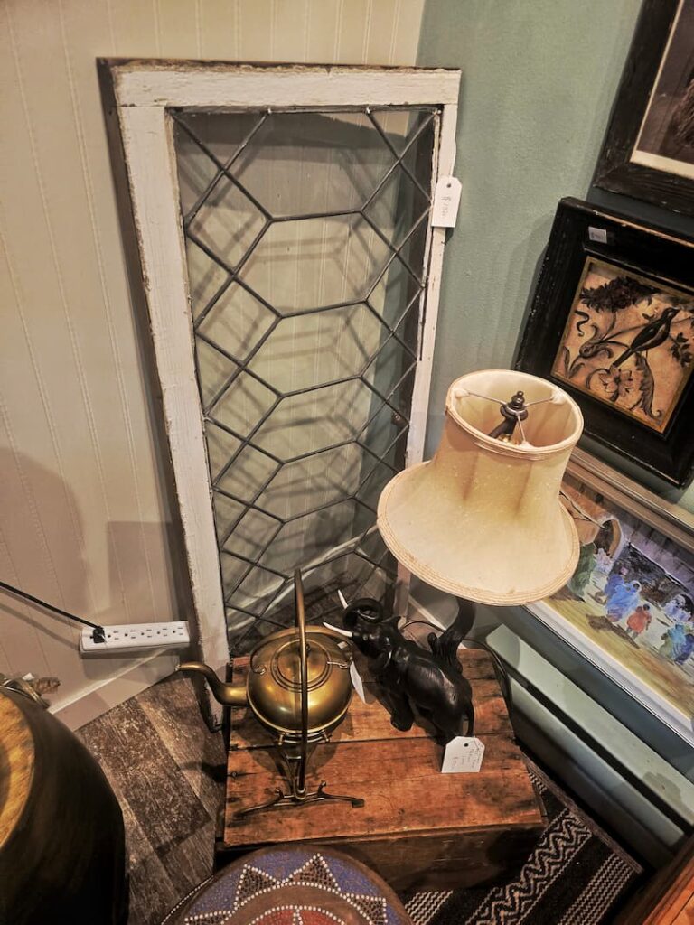 leaded glass window and a lamp in the vintage store