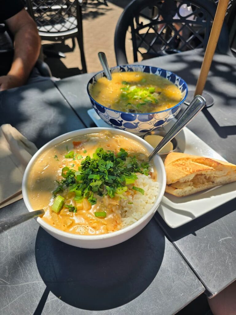 soup and a rice bowl on a patio table