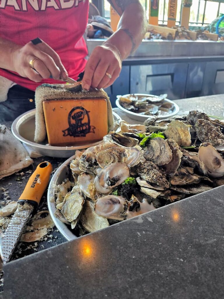 Shucking oysters at Smitty's Oyster Bar in Gibsons, BC Canada