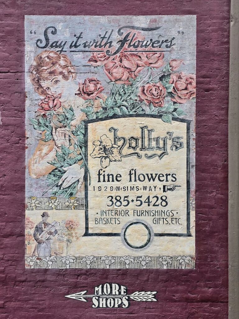 Holly's Fine Flowers sign painted on a brick building in Port Townsend Washington