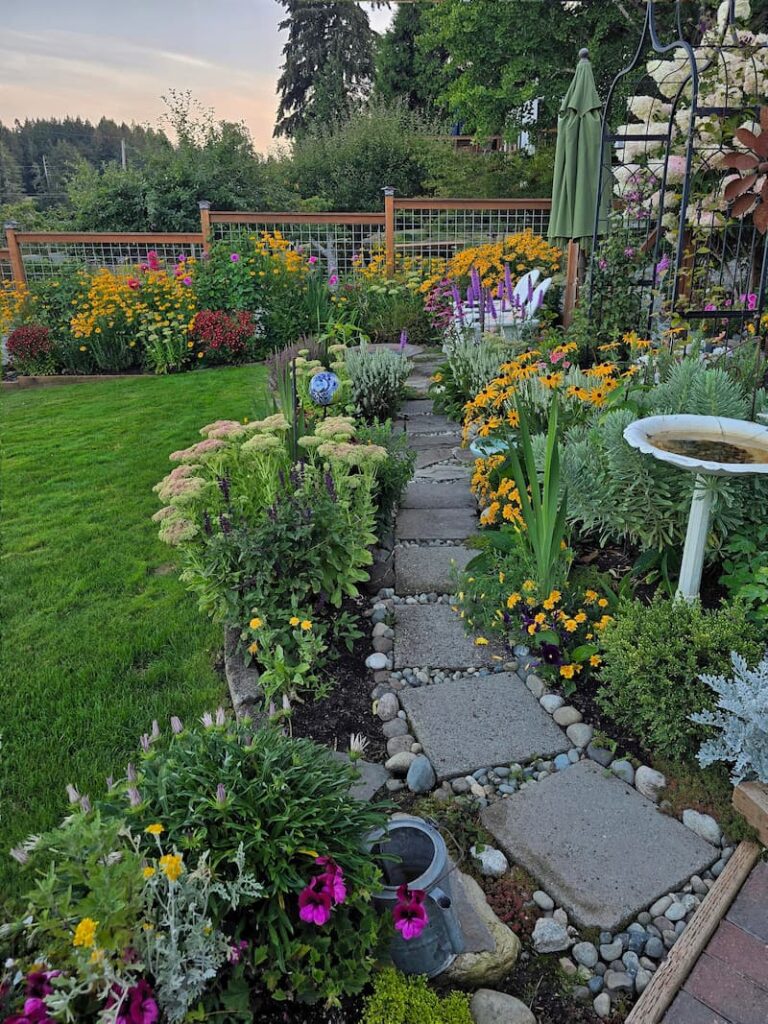 Late summer cottage garden pathway leading at a Pacific Northwest beach cottage