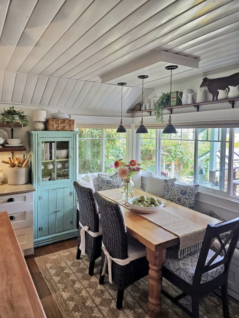 Bright and airy cottage kitchen eating nook in August at a Puget Sound beach cottage