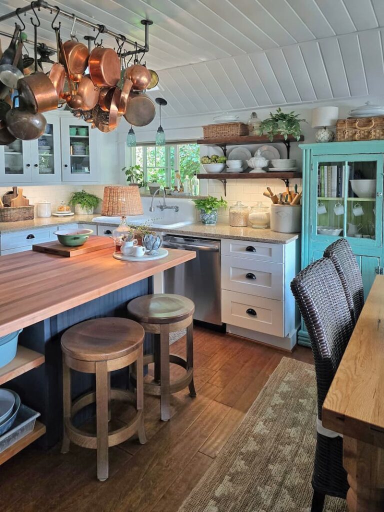 Cottage kitchen with vintage touches and summer flowers in August
