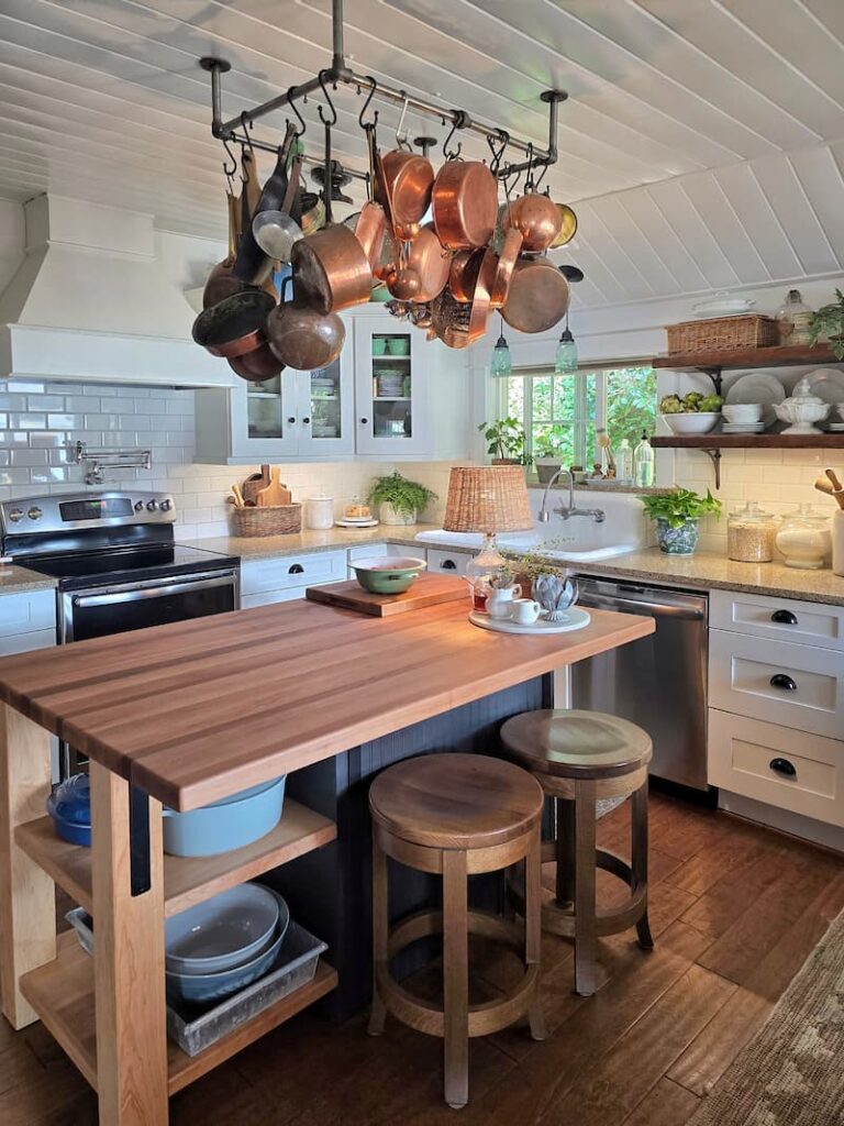 Custom kitchen island with workspace for cooking and sourdough bread baking in a cottage kitchen